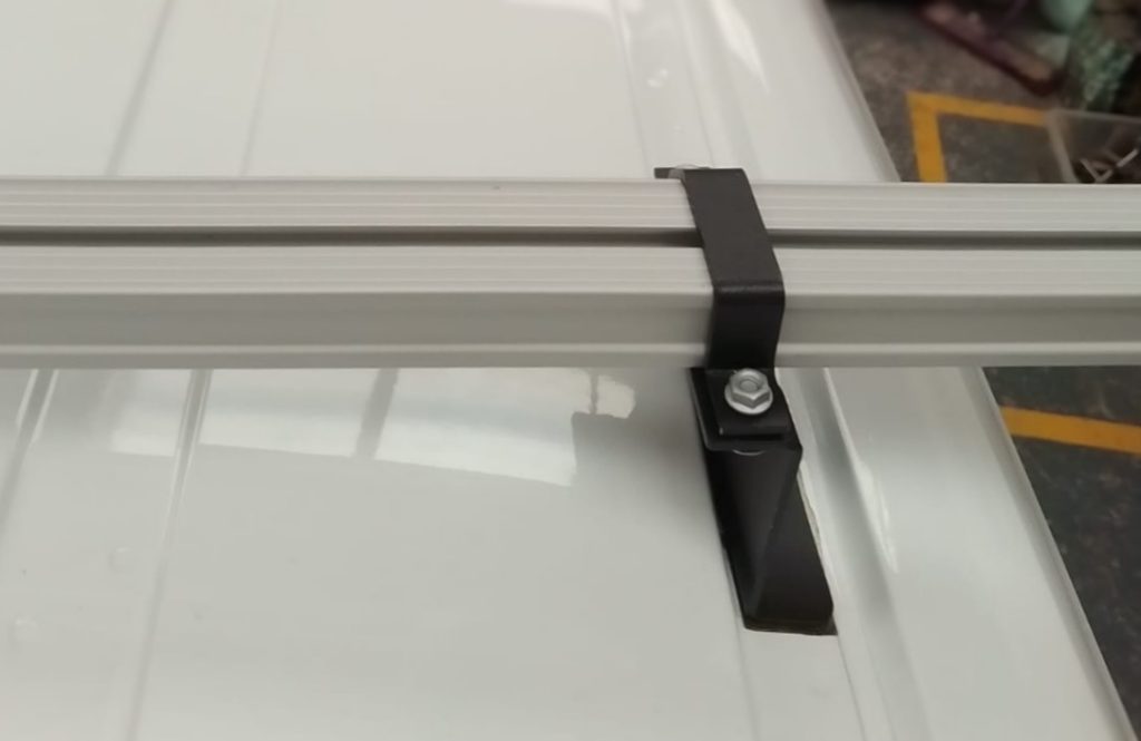 An ULTI Bar+ securely attached to a Transit Connect roof bracket