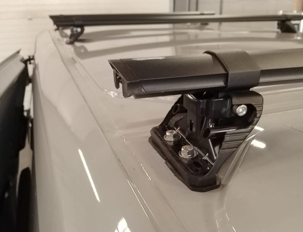 Bolting roof bars into place on Transit Custom