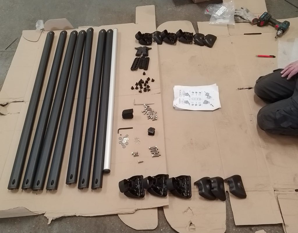 Unboxed Black KammRack parts laid out